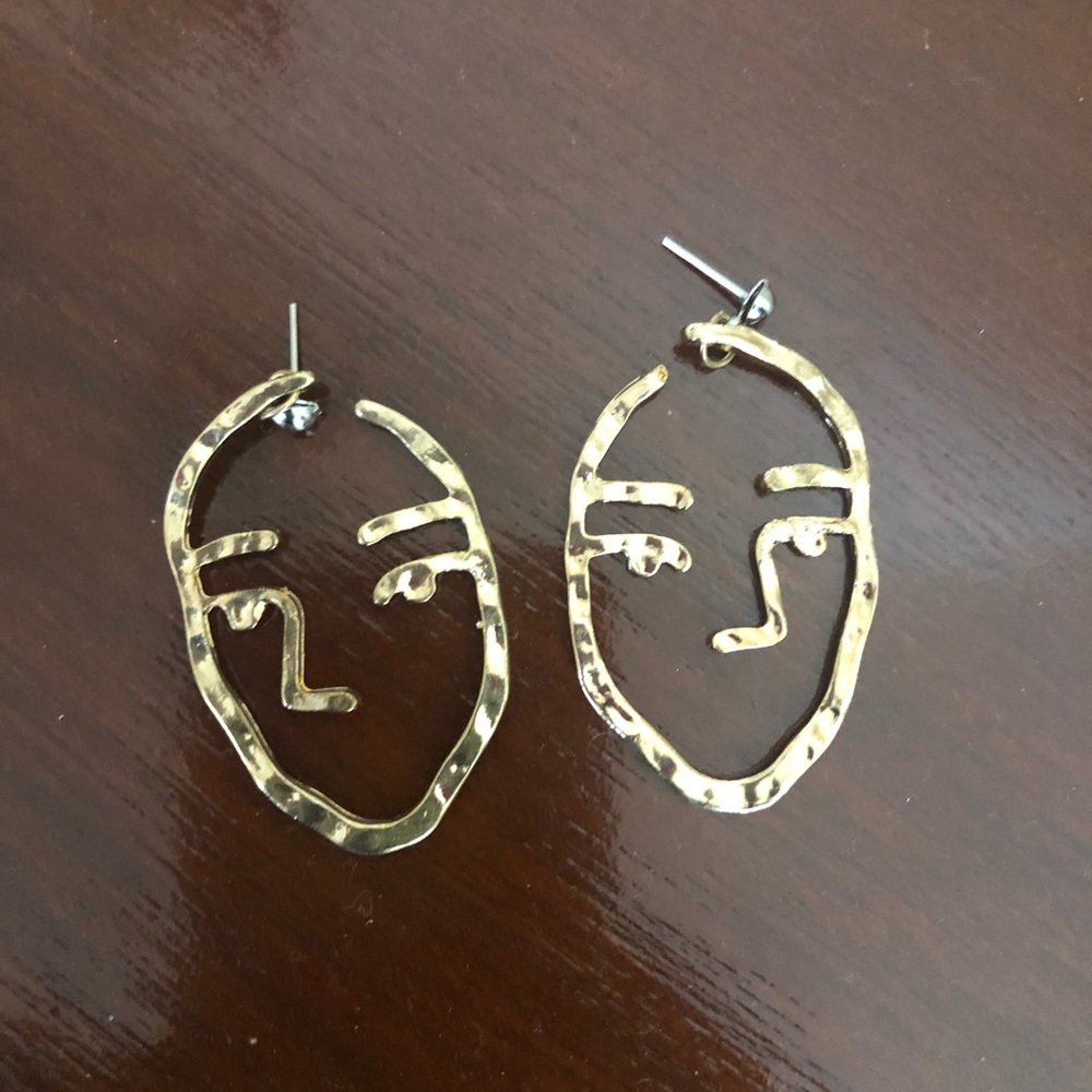 Gold face earring